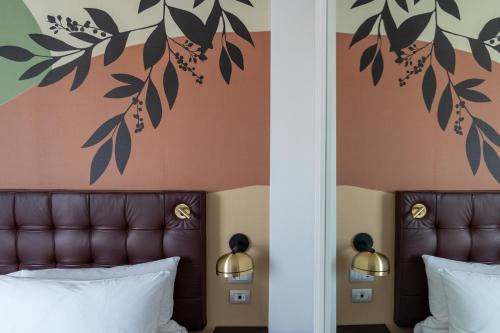 Habitación Doble Deluxe en esquina con cama grande del hotel DoubleTree by Hilton Florence Metropole. Foto 6