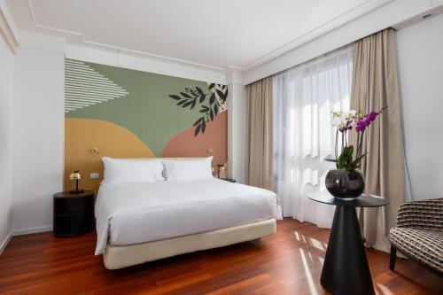 Suite Junior Familiar con cama extragrande del hotel DoubleTree by Hilton Florence Metropole