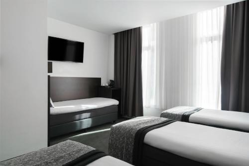 Habitación cuádruple del hotel City Garden Amsterdam. Foto 4