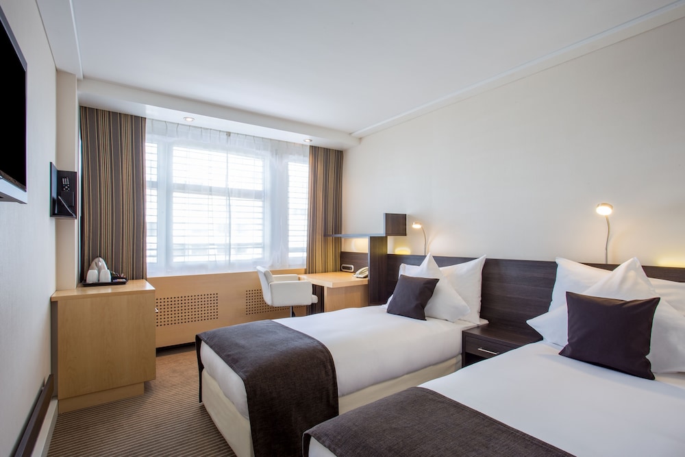 Habitación estándar, 2 camas individuales del hotel Crowne Plaza Zürich, An Ihg