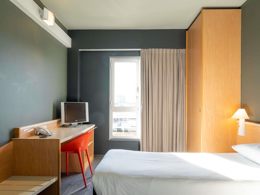 Habitación con camas individuales del hotel Ibis Florence North Airport