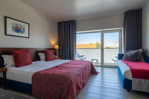 Habitación Doble Estándar con 1 cama supletoria - 1 o 2 camas del hotel Ílhavo Plaza