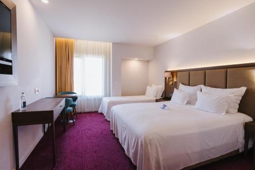 Habitación Triple del hotel Aquae Flaviae - Premium Chaves. Foto 1