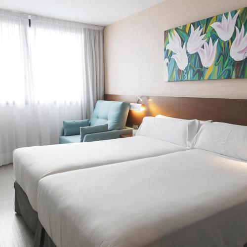 Habitación Triple del hotel and Spa Real Ciudad De Zaragoza