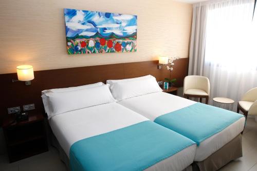Habitación cuádruple del hotel and Spa Real Ciudad De Zaragoza