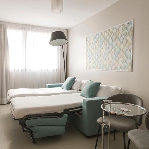 Habitación cuádruple del hotel and Spa Real Ciudad De Zaragoza. Foto 5