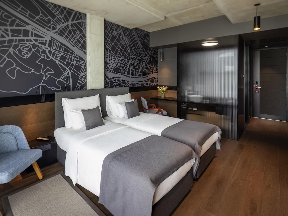 Habitación Deluxe, 2 camas individuales del hotel Mövenpick Zagreb. Foto 2