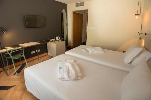 Habitación Doble Deluxe - 2 camas del hotel Azoris Angra Garden. Foto 3