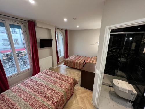 Habitación cuádruple del hotel Hipotel Paris Printania Maraîchers. Foto 1