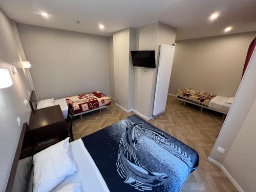 Habitación cuádruple del hotel Hipotel Paris Printania Maraîchers. Foto 4