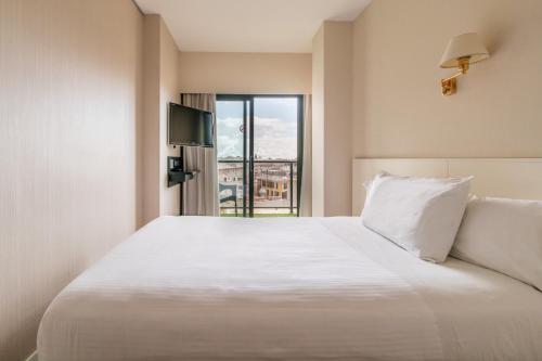 Habitación Individual con balcón del hotel Palladium. Foto 1