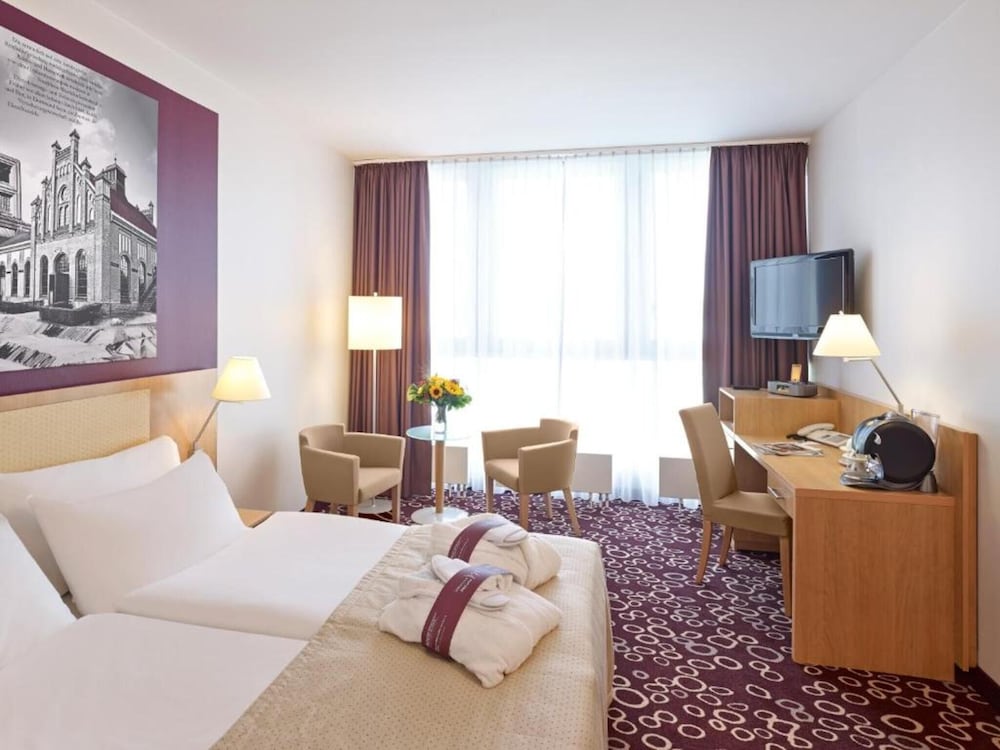 Habitación estándar con cama king o dos camas individuales del hotel Mercure Dortmund City. Foto 1
