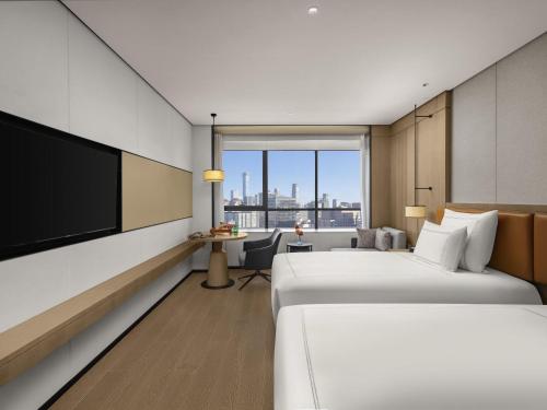 Swiss Executive Twin Room with Lounge Access - High Floor del hotel Swissôtel Beijing Hong Kong Macau Center. Foto 2
