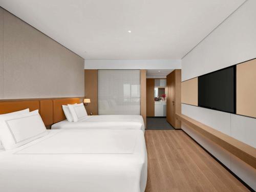 Swiss Executive Twin Room with Lounge Access - High Floor del hotel Swissôtel Beijing Hong Kong Macau Center. Foto 3