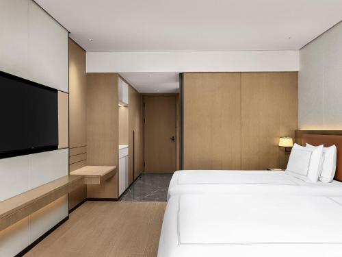 Habitación Premier con 2 camas individuales del hotel Swissôtel Beijing Hong Kong Macau Center. Foto 5