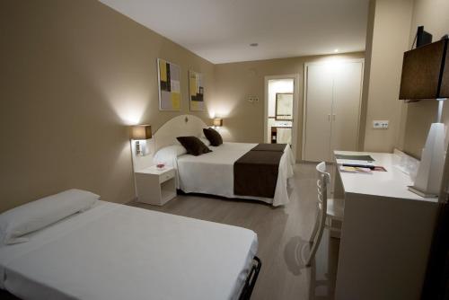 Habitación Triple del hotel Sercotel Torico Plaza. Foto 1