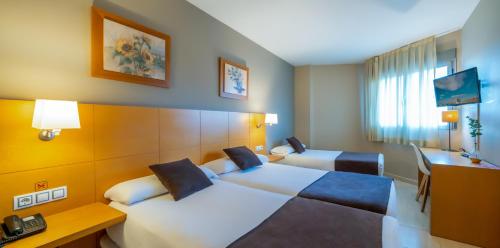 Habitación Doble con Cama supletoria del hotel La City Estación. Foto 6