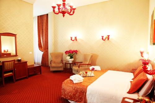 Habitación cuádruple del hotel Augusta Lucilla Palace. Foto 1