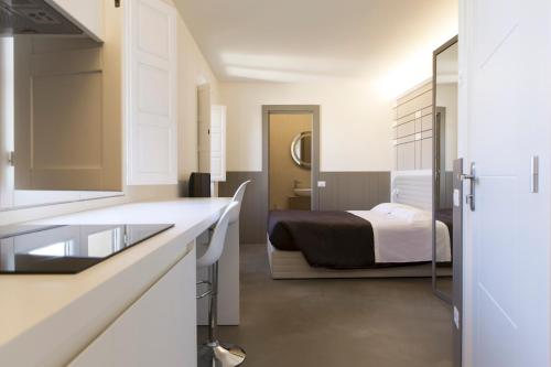 Suite Deluxe del hotel PALAZZO DEI CIOMPI. Foto 7