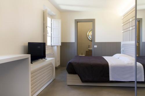 Suite Deluxe del hotel PALAZZO DEI CIOMPI. Foto 10