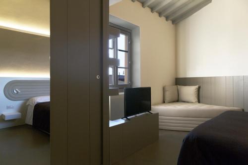 Suite Con Cocina 1 Cama king 1 habitación Vista ciudad Sofá Cama incluido Normal del hotel PALAZZO DEI CIOMPI