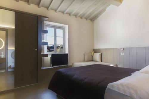 Suite Con Cocina 1 Cama king 1 habitación Vista ciudad Sofá Cama incluido Normal del hotel PALAZZO DEI CIOMPI. Foto 5
