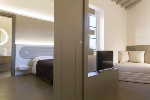 Suite Con Cocina 1 Cama king 1 habitación Vista ciudad Sofá Cama incluido Normal del hotel PALAZZO DEI CIOMPI. Foto 12
