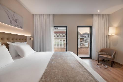 Habitación Doble con cama supletoria del hotel Eurostars Das Letras. Foto 1