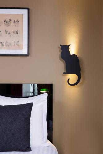 Habitación Triple Deluxe del hotel Le Chat Noir. Foto 1