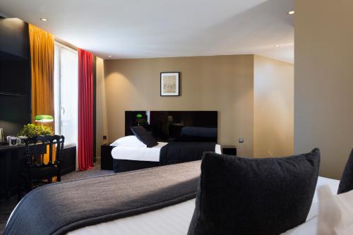 Habitación Triple Deluxe del hotel Le Chat Noir. Foto 3