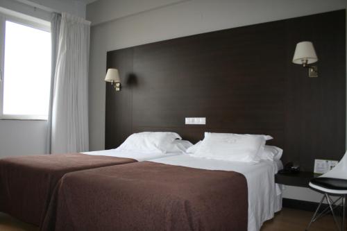 Habitación doble 3 camas individuales del hotel Méndez Núñez. Foto 4
