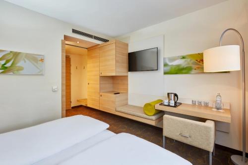 Habitación Doble Confort - 1 o 2 camas del hotel H+ Hotel Salzburg. Foto 2