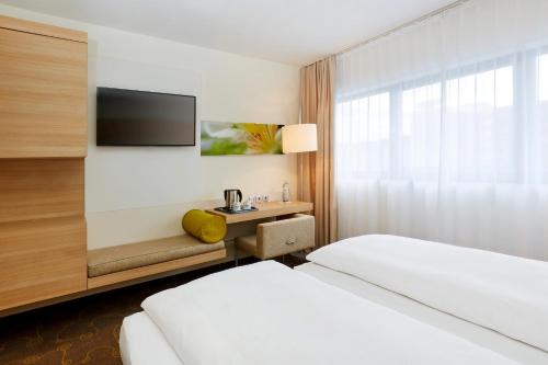 Habitación Doble Confort - 1 o 2 camas del hotel H+ Hotel Salzburg. Foto 3