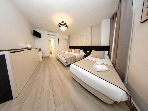 Habitación Triple con servicio gratuito de enlace con el aeropuerto del hotel Zen Airport. Foto 7