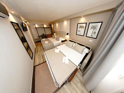 Habitación Cuádruple Confort con traslado gratuito al aeropuerto del hotel Zen Airport. Foto 4