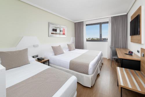 Habitación Triple Urban del hotel Alexandre Frontair Congress. Foto 1