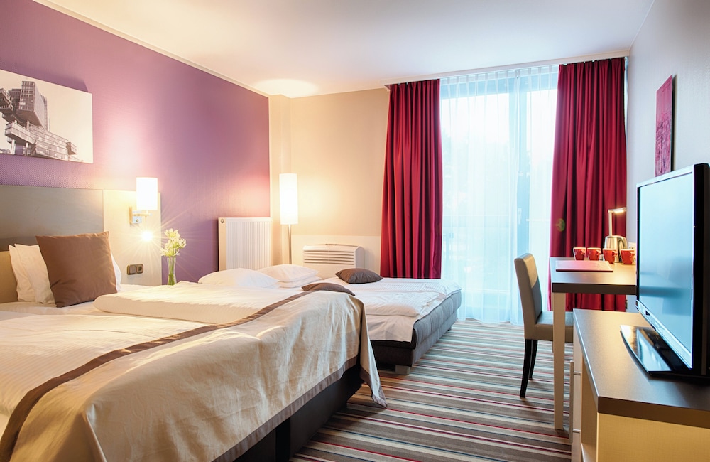 Habitación Cuádruple Confort del hotel Leonardo Hannover Airport. Foto 1