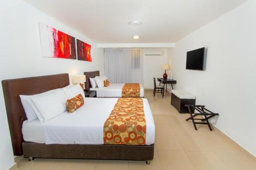 Habitación cuádruple del hotel Playa Club. Foto 2