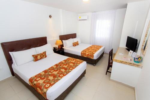 Habitación cuádruple del hotel Playa Club. Foto 3