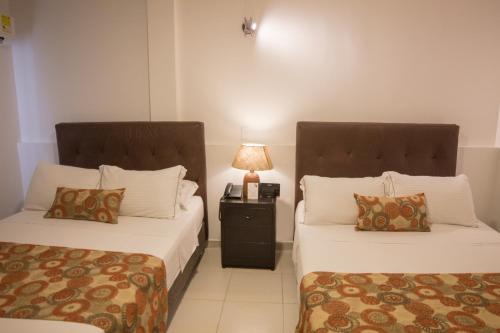 Habitación cuádruple del hotel Playa Club. Foto 5