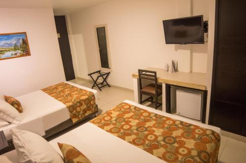 Habitación cuádruple del hotel Playa Club. Foto 6