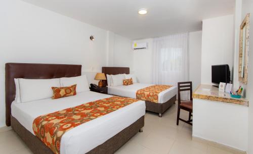 Habitación Cuádruple del hotel Playa Club. Foto 9