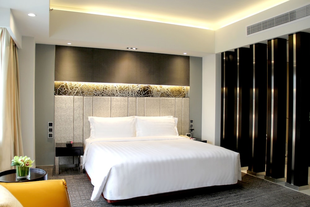 Suite Junior, 1 cama king size, zona de estar separada, beneficios de la planta ejecutiva del hotel Grand Mercure Shanghai Hongqiao. Foto 1