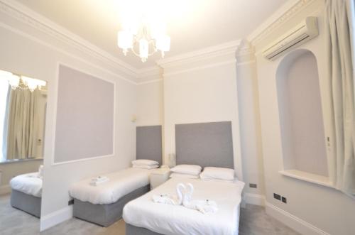 Habitación Triple Executive del hotel Amber Residence. Foto 3