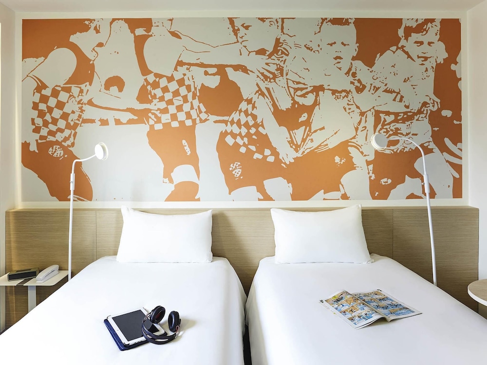 Habitación estándar con camas individuales del hotel ibis Styles Toulouse Nord Sesquières