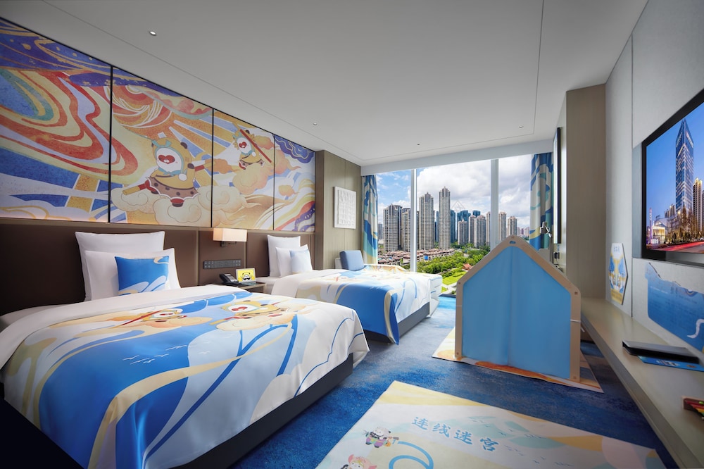 Habitación Deluxe, varias camas del hotel Pullman Huai'an. Foto 1