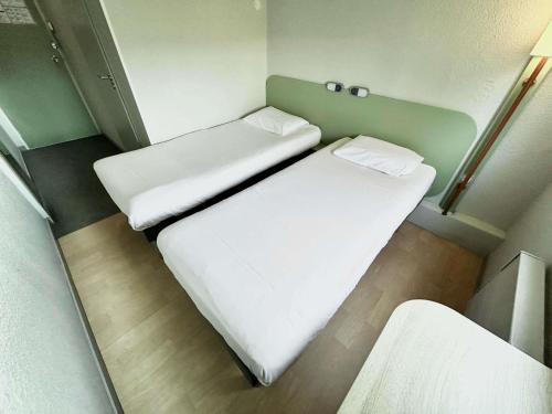 TWIN - Habitación con dos camas individuales del hotel ibis budget Beaune. Foto 2