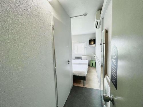TWIN - Habitación con dos camas individuales del hotel ibis budget Beaune. Foto 3