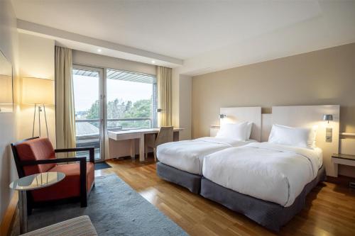 Habitación Doble con balcón - 2 camas del hotel Hilton Helsinki Kalastajatorppa. Foto 5