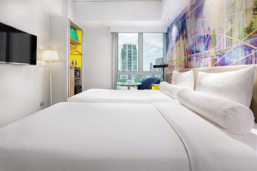Habitación Standard con dos camas individuales del hotel Ibis Styles Manila Araneta City. Foto 1